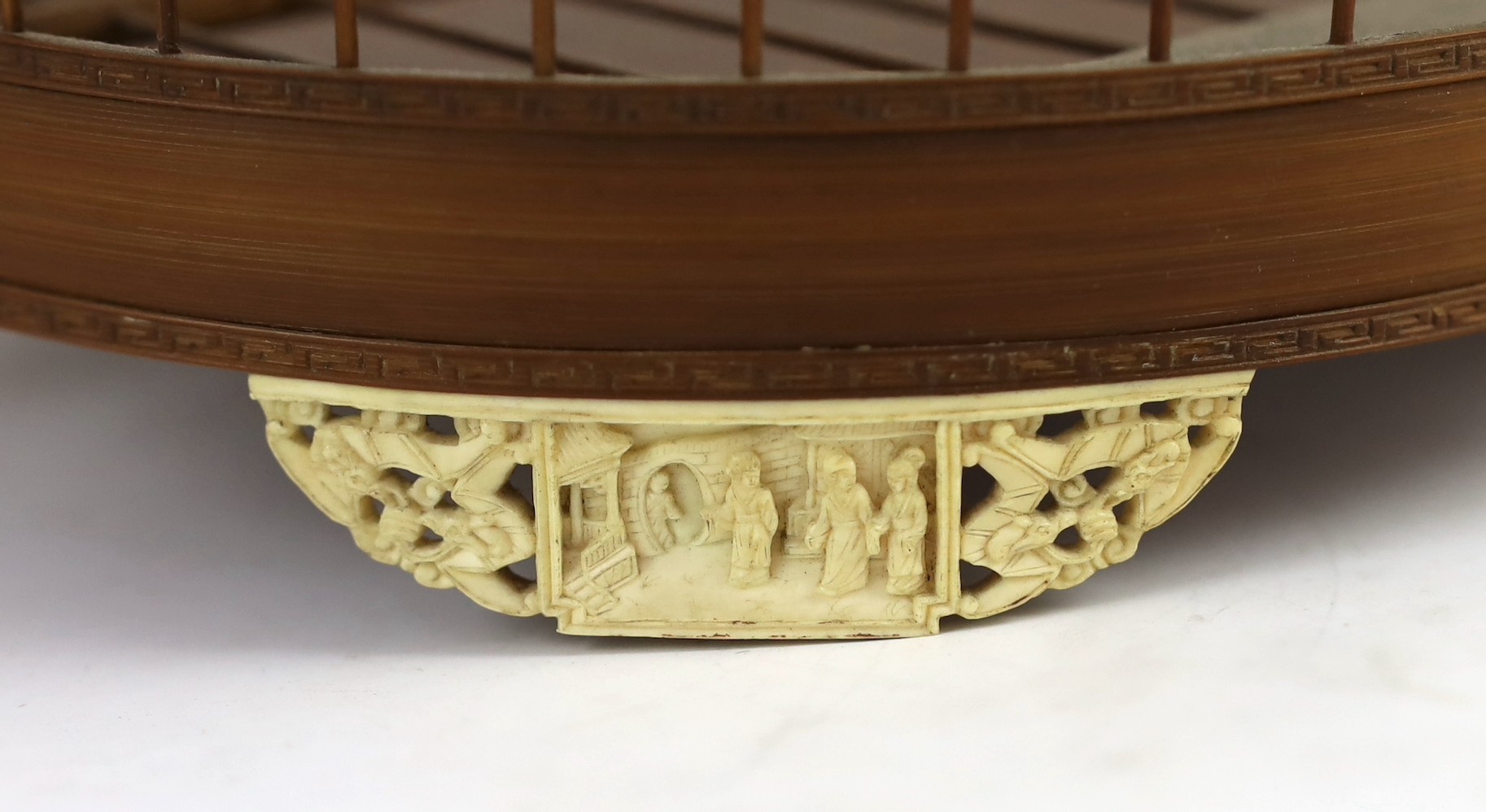 A Chinese bamboo and Guangzhou ivory mounted bird cage, late Qing dynasty, with two Guangxu mark and period porcelain bird feeders (1875-1908), cage 32.5cm high to top of handle